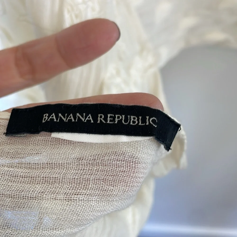 Banana Republic cream lightweight scarf or wrap with Pom Pom ball detail.